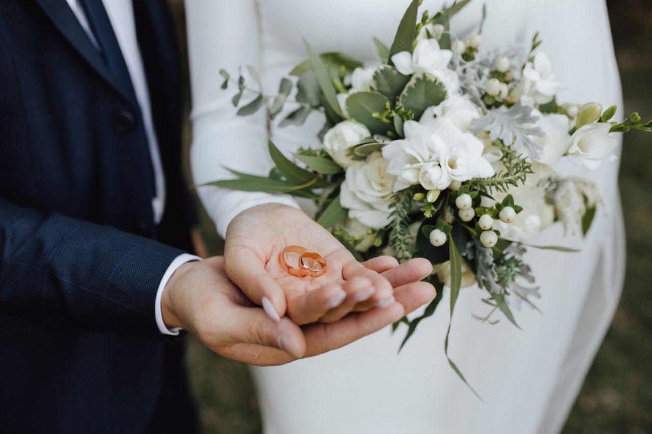 wedding-bands-hands-bride-groom-with-beautiful-wedding-bouquet-made-greenery-white-flowers-1280x853.jpg