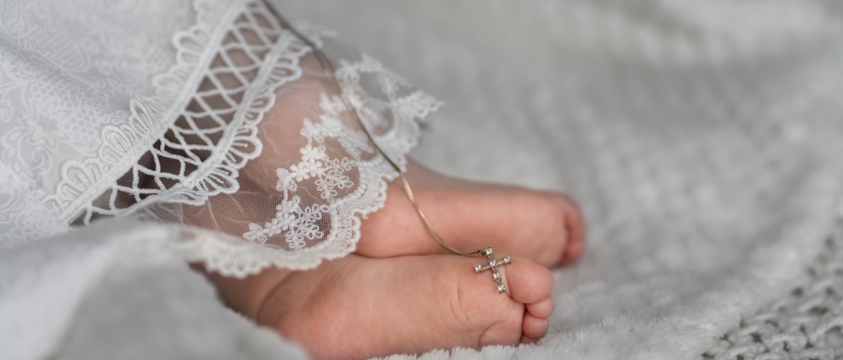 high-angle-baby-feet-with-cross-1.png